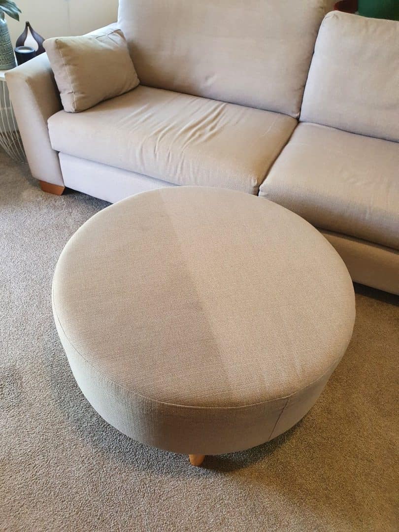 Upholstery cleaning - fabric ottoman half cleaned